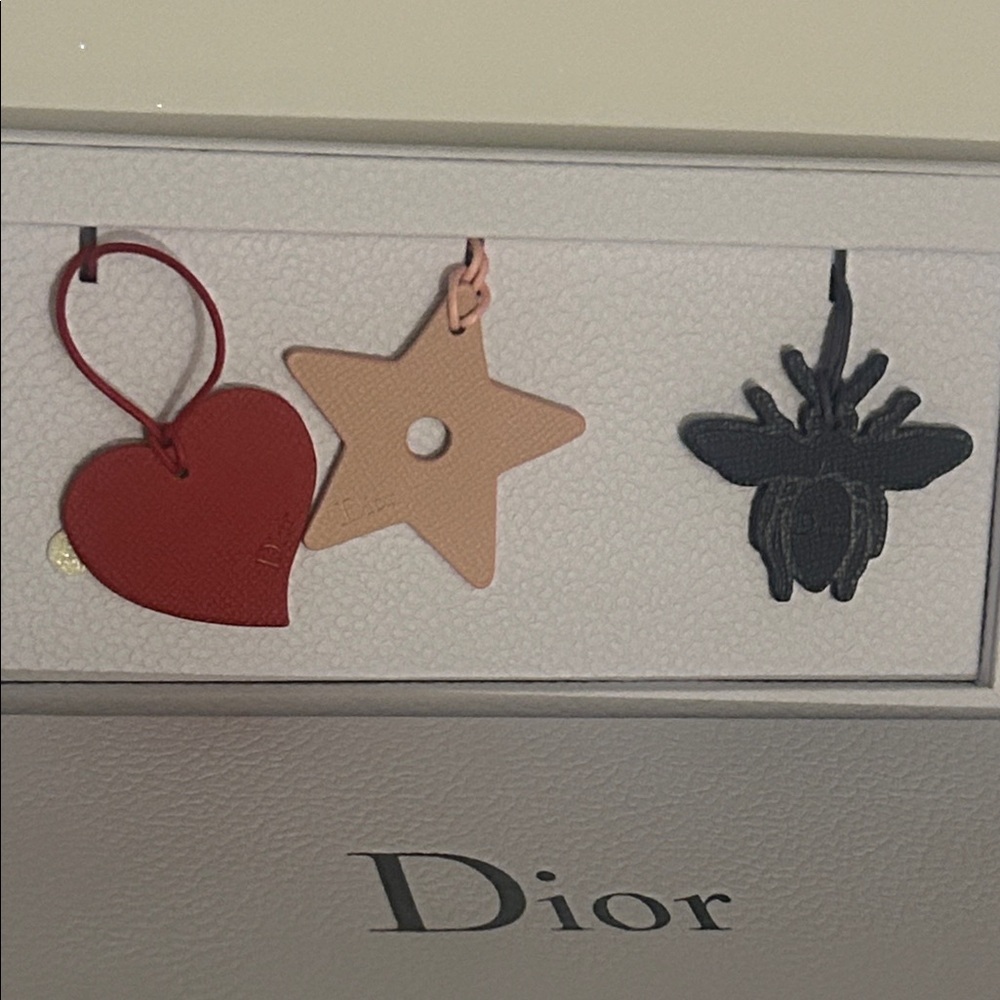 Dior Red Heart, Pink Star, and Black Bee Charms